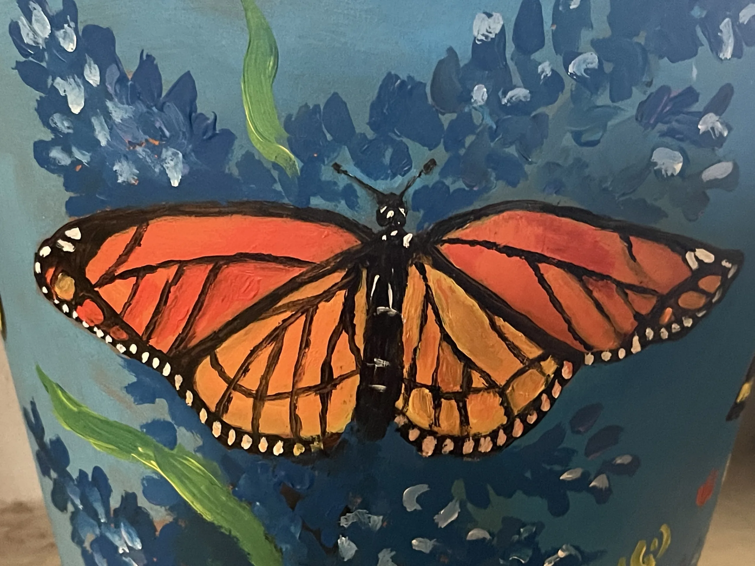 Monarch painting on pot